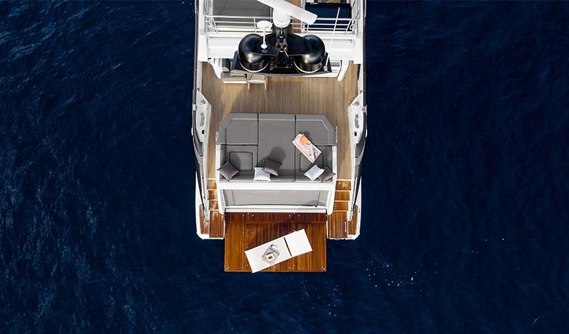 the aft deck of a large yacht in deep blue water