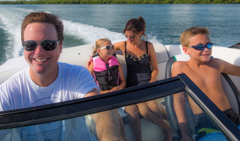 family on sport boat