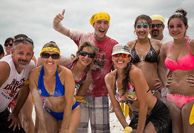 People on beach having fun at MarineMax event