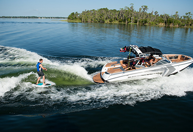 Wakesurfer behind Nautique towboat