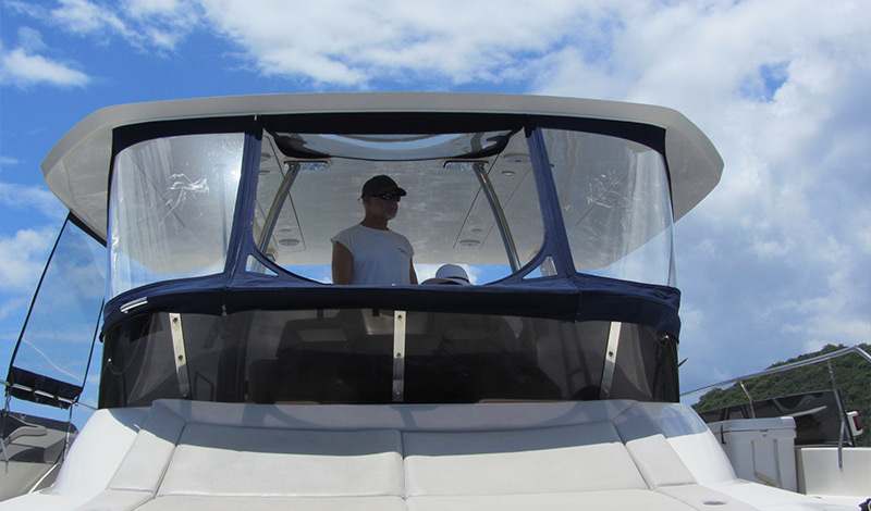 captain on the flybridge of an marinemax vacations 484 in the british virgin islands
