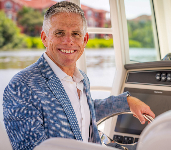 MarineMax CEO Brett McGill aboard a boat