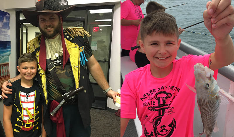 a boy in a pink shirt holding a fish and a boy smiling next to a man dressed as a pirate