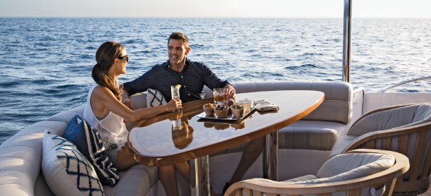 Couple dining on their yacht