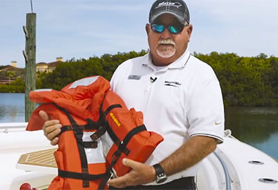Captain Keith holding a life jacket