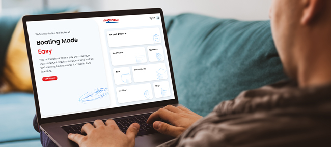 man on the computer working on the my marinemax account