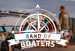 the words band of boaters below a compass logo with a family on a dock in the background