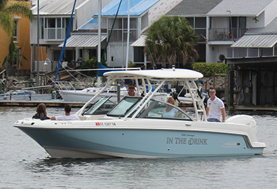 A family on a Boston Whaler 230 Vantage