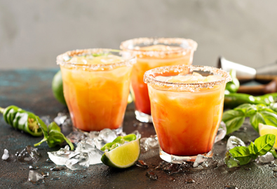 Margaritas and limes on a table