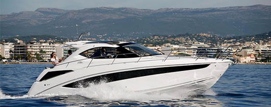 boat running with city in the background