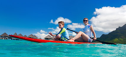 two people paddle boarding