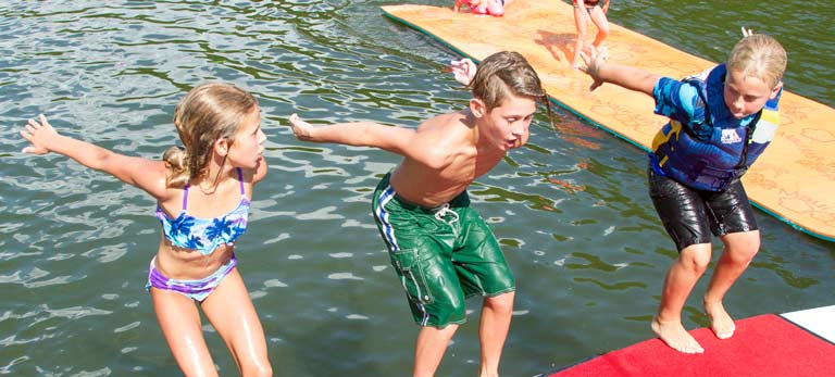 kids getting ready to jump into the water