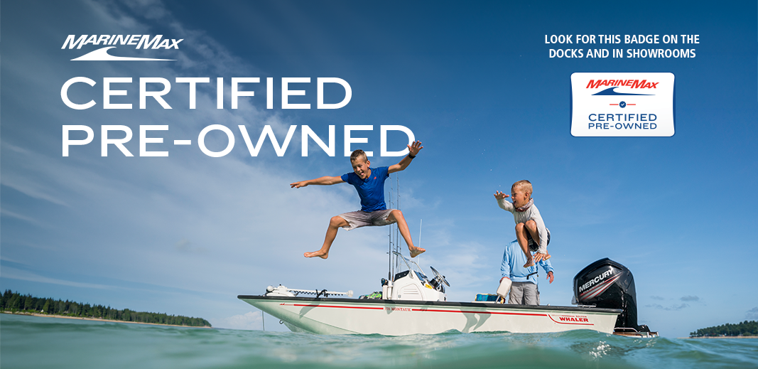 a family enjoying their pre owned marinemax boat