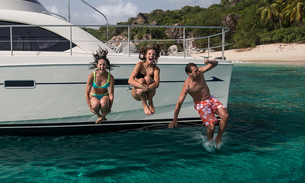 Jumping into the Water Part of Charter Yacht Vacations in the BVI