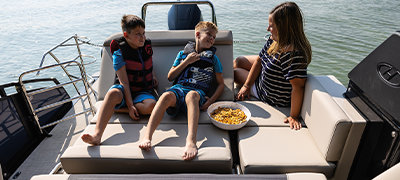A family enjoying snacks aboard their boat
