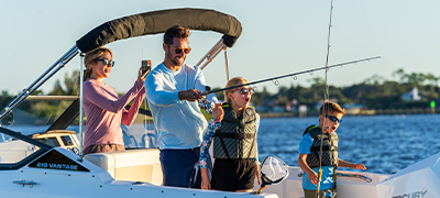 A family fishing on their Boston Whaler 210 Vantage
