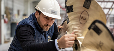 A Galeon worker inspecting a propeller
