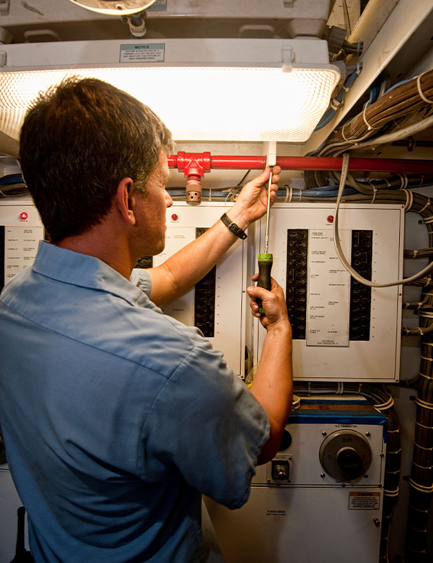 Service team member working on boat