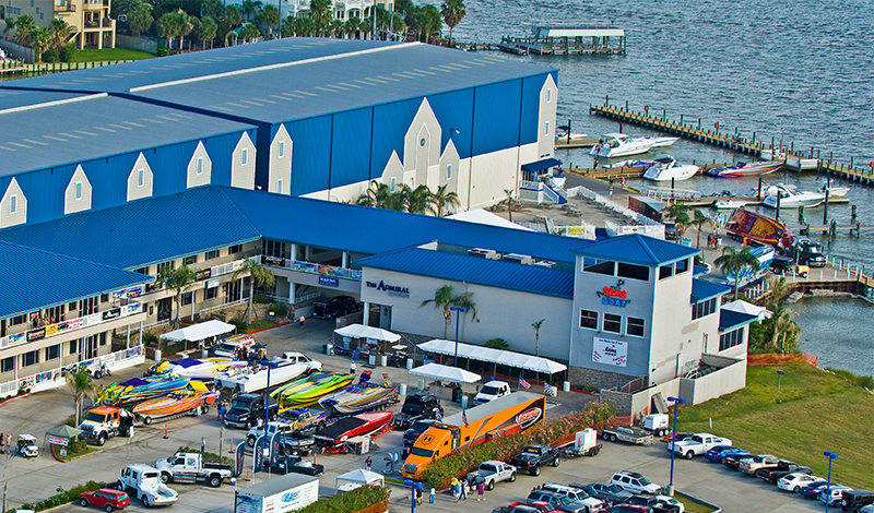 View of MarineMax Houston Marine with boats in water slips in the distance