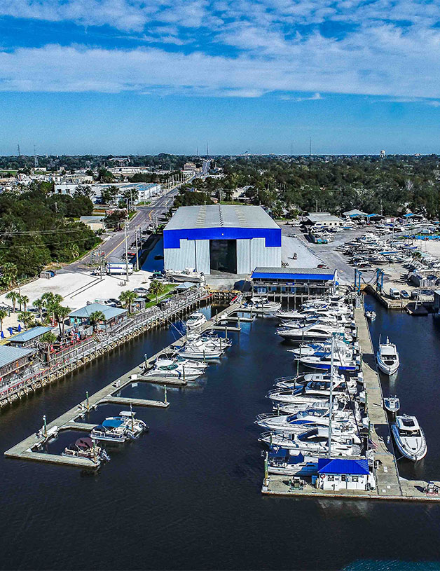 Boats anchored at in-water storage at MarineMax Pensacola marina