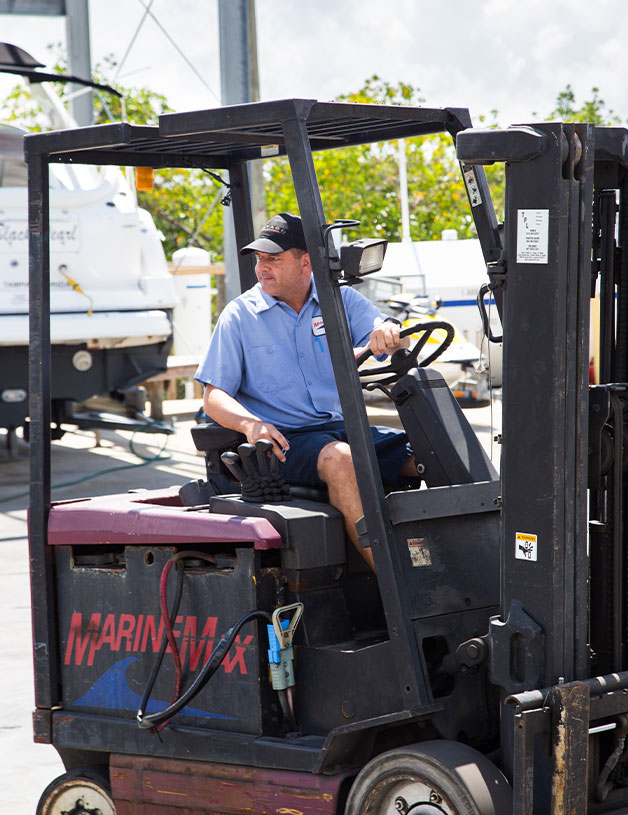 MarineMax service team member on machine