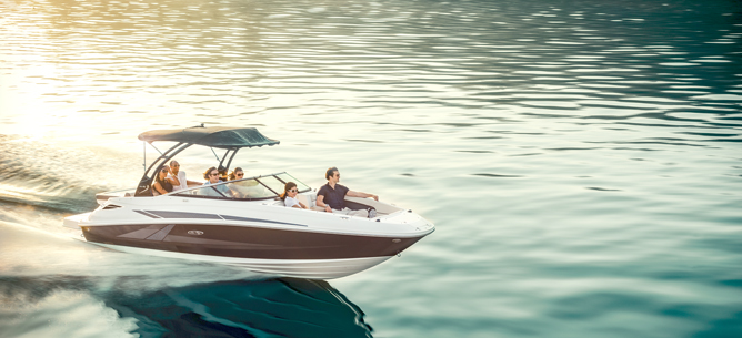 People on sport boat speed across ocean