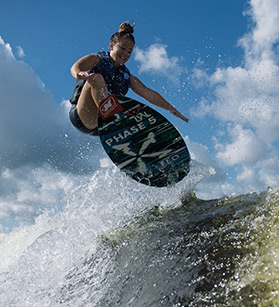 Wakeboarder behind Nautique boat