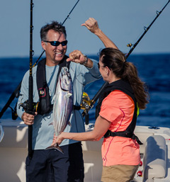 Couple caught a fish while boating