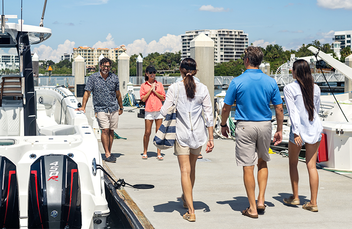 group of people walking at a boat show
