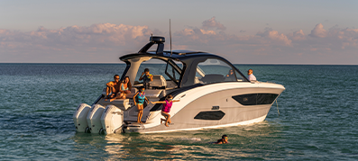 Sea ray with a family on the water