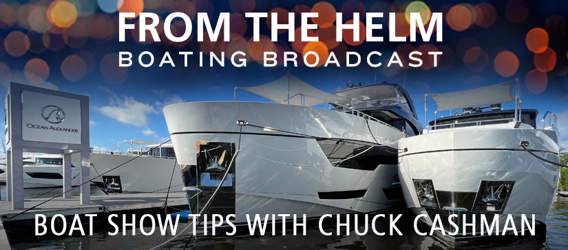 Two white Ocean Alexander yachts sit docked side by side in a marina