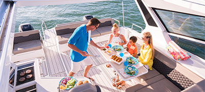 Family eating aboard an Aquila 36