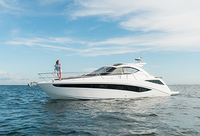 woman standing on the bow of a galeon 385 hts in wide open water