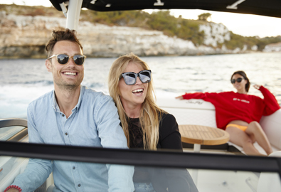 Three people aboard a boat