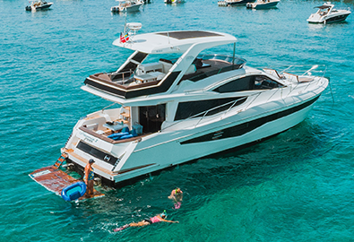 A family aboard a Galeon yacht in the water