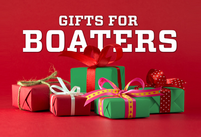 Christmas presents in front of a red background with the words Gifts for Boaters