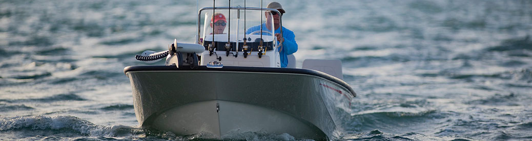 Boat in water cruising and people ready to fish