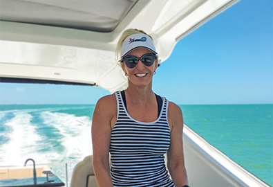 Stacey captaining her Sea Ray yacht