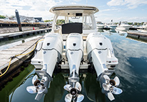 three outboard motors on a boat