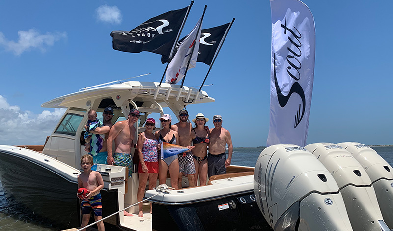 marinemax charleston boat with a happy group of people on board