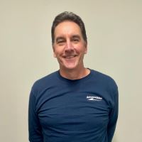 Headshot of John Luti