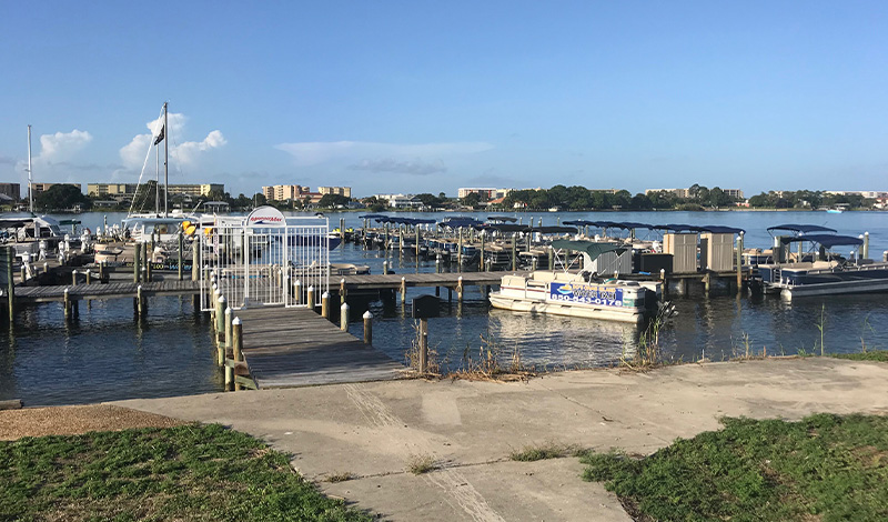 a dock with boats outside the marinemax fort walton beach office