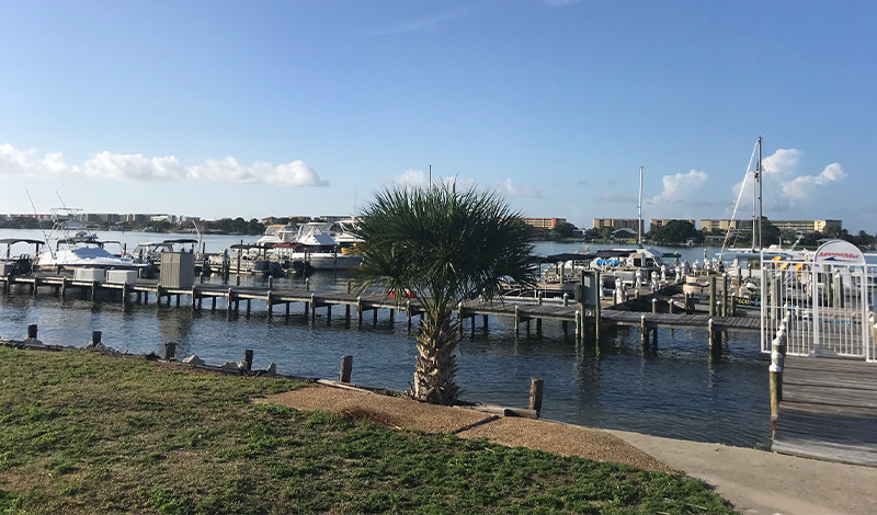 a dock with boats outside the marinemax fort walton beach office