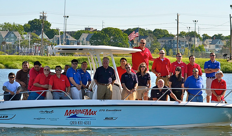 marinemax norwalk team members on board of a boat