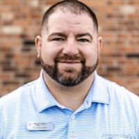 Headshot of DJ Delaney