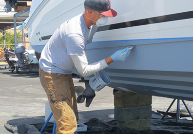 MarineMax Wrightsville Beach team member working on a boat