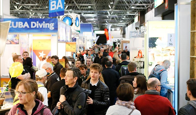 people walking through display booths at 2019 boot düsseldorf event