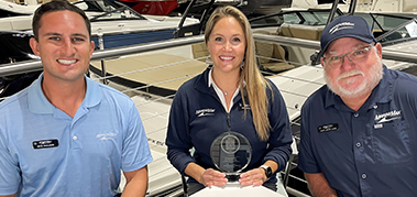 MarineMax accepts an award and poses for a photo