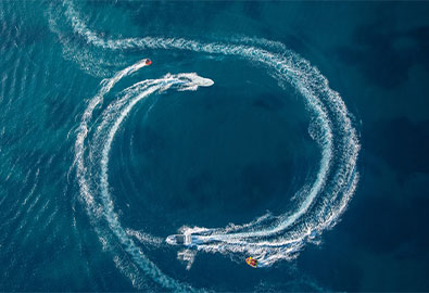 boats creating circle in wake