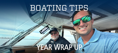 Captain Nick and Captain Keith smiling on a boat